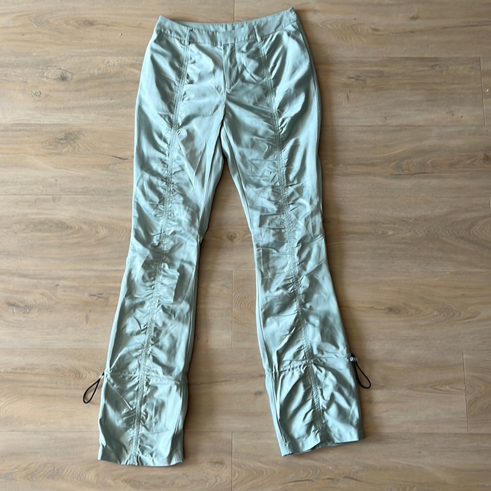 Shiny green pants, low rise. Size M, fits S. From Editorial Boutique.